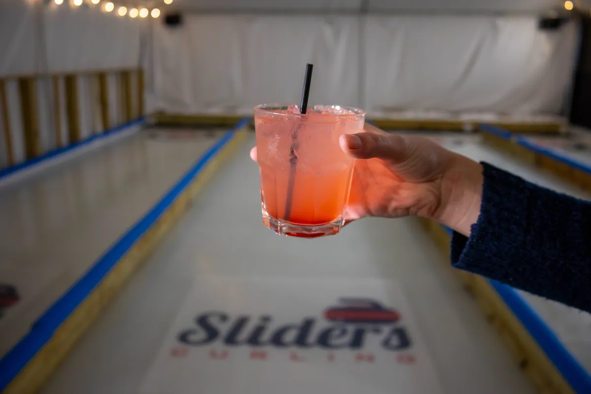 A cocktail held over the curling ice
