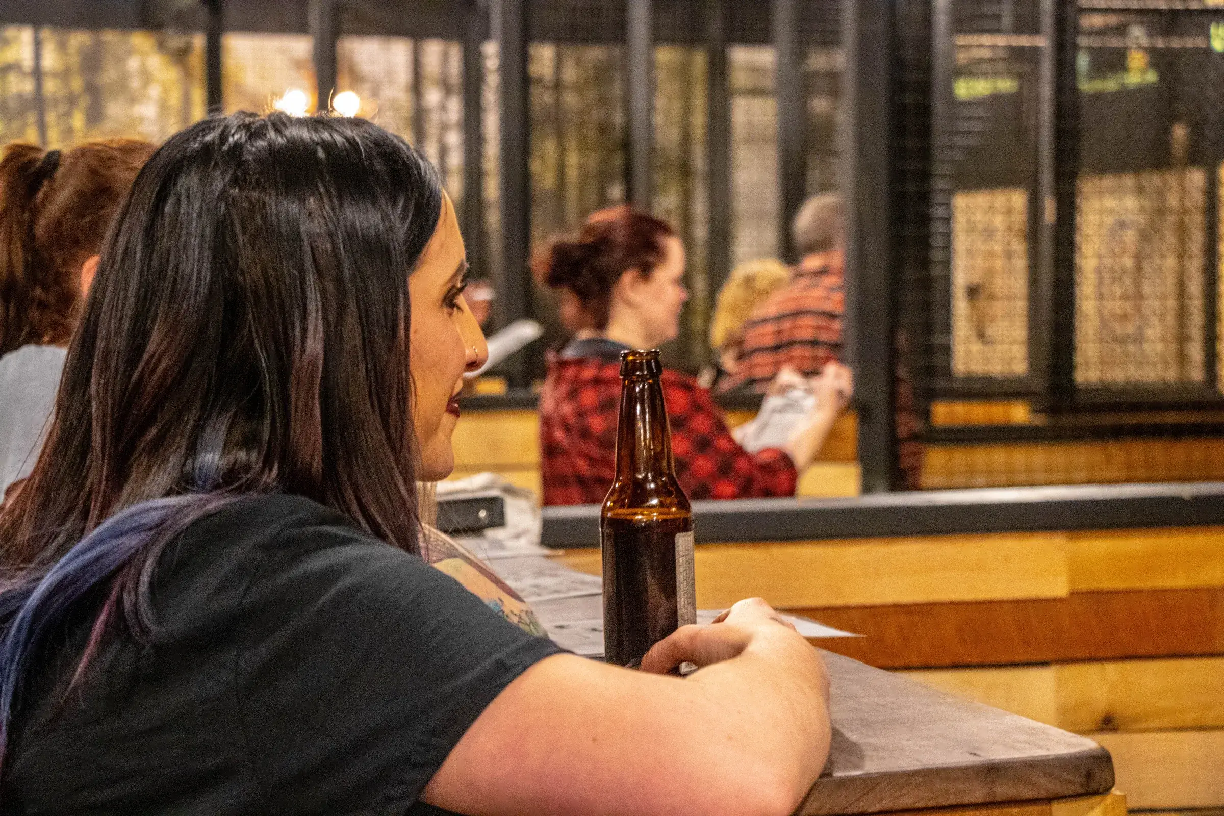 Guests at the bar rail between rounds